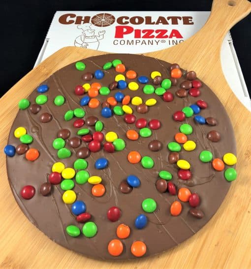 Chocolate Pizza topped with colorful chocolate candy served in a pizza box