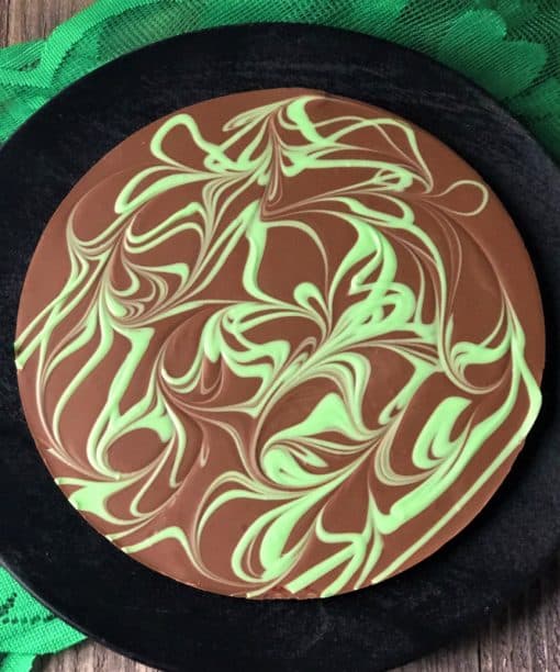 top view of chocolate pizza with green swirls