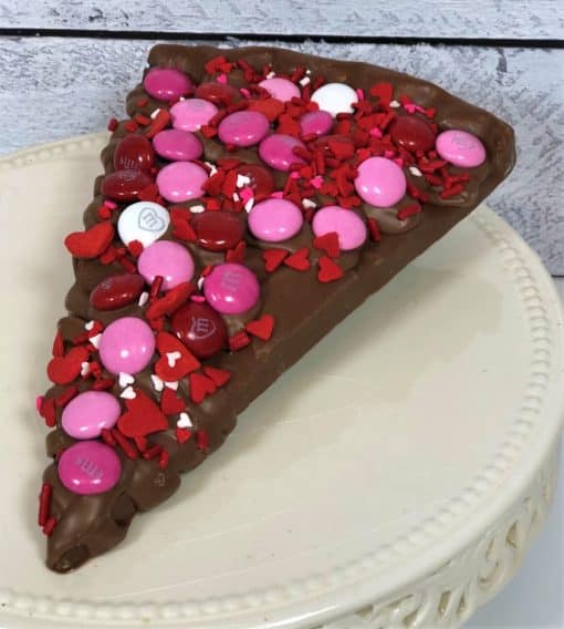 chocolate pizza slice with Valentines candy