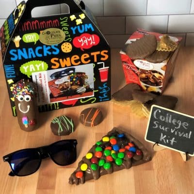 college survival kit with chocolate treats in tote box