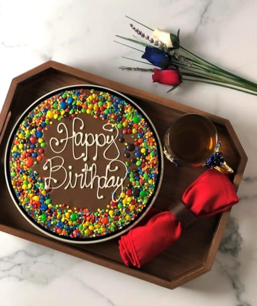 happy birthday chocolate pizza on wood tray