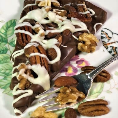 slice chocolate pizza with nuts on plate