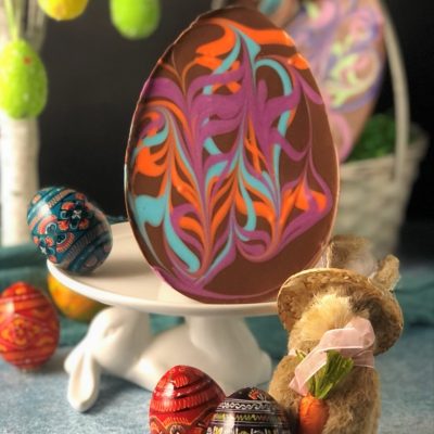 chocolate Easter egg with pastel swirls