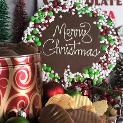 merry Christmas chocolate pizza peanut butter wings in holiday tin