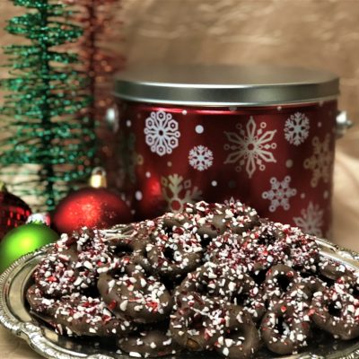 candy cane pretzels in red snowflake tin