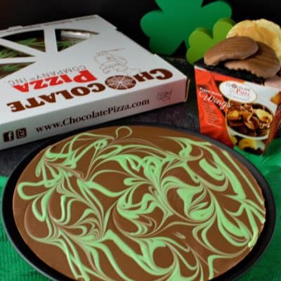 chocolate pizza with green swirls and Irish cream flavor with peanut butter wings box