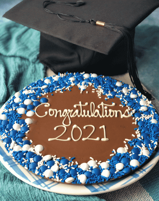 graduation chocolate pizza with blue and white candies