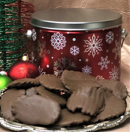chocolate covered chips in red tin with white snowflakes